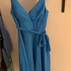 7. Azazie Blue Sleeveless Wrap Maxi Dress